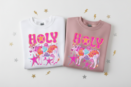 Holy Cow sweatshirts folded flat lay white and dusty mauve