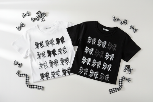 Checkered Bows long sleeve tees folded flat lay white and black