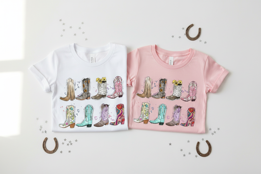 Youth and toddler cowboy boots tees folded flat lay