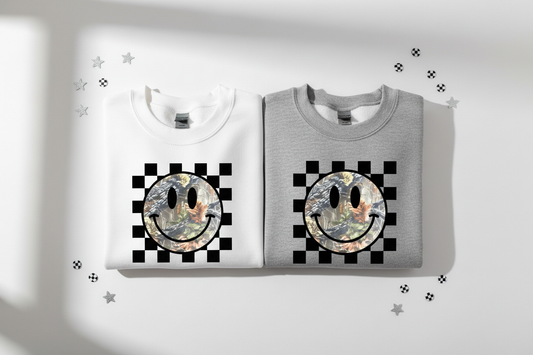 Checkered Camo Smiley sweatshirts folded flat lay white and heather gray